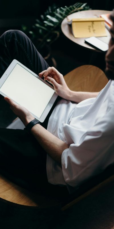 Man in White Button Up Shirt Holding White Tablet Computer